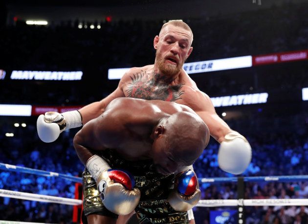Conor McGregor in action with Floyd Mayweather Jr.