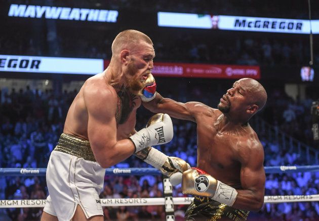 Conor McGregor, left, and Floyd Mayweather Jr during their super welterweight boxing match at T-Mobile Arena in Las Vegas, USA.