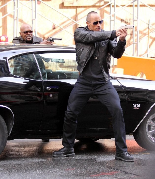 Dwayne "The Rock" Johnson and Samuel L. Jackson film a shoot-out scene for their new film 'The Other Guys,' April, 2014. (Photo by Philip Ramey/Corbis via Getty Images)