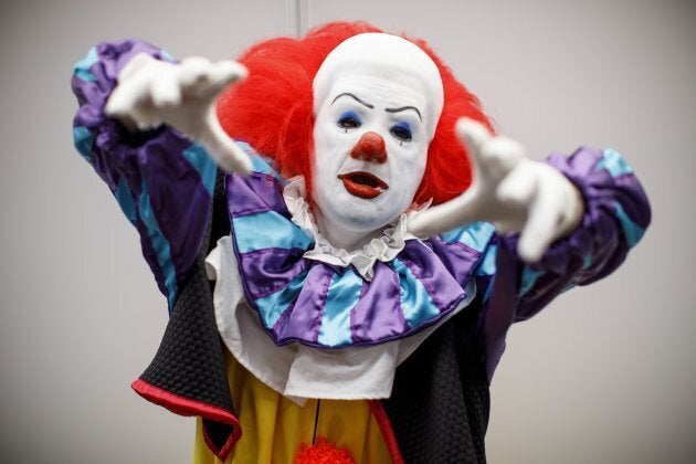 A cosplayer dressed as Pennywise the Dancing Clown attends London Super Comic Convention at Business Design Centre in Islington, London on August 26, 2017. / AFP PHOTO / Tolga AKMEN (Photo credit should read TOLGA AKMEN/AFP/Getty Images)