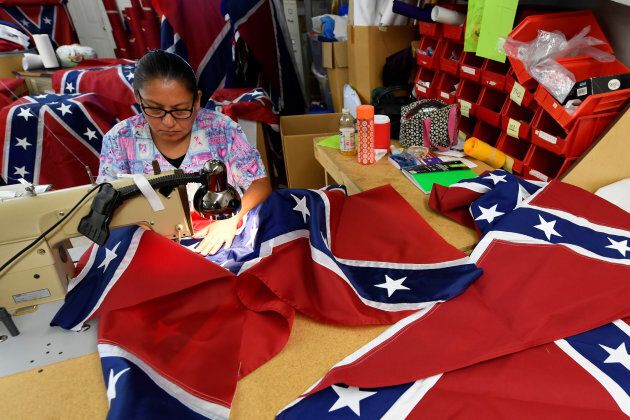 Blanca Hernandez sews stars on a Confederate Battle Flag in the Alabama Flag & Banner shop in Huntsville, Ala., Aug. 24, 2017.