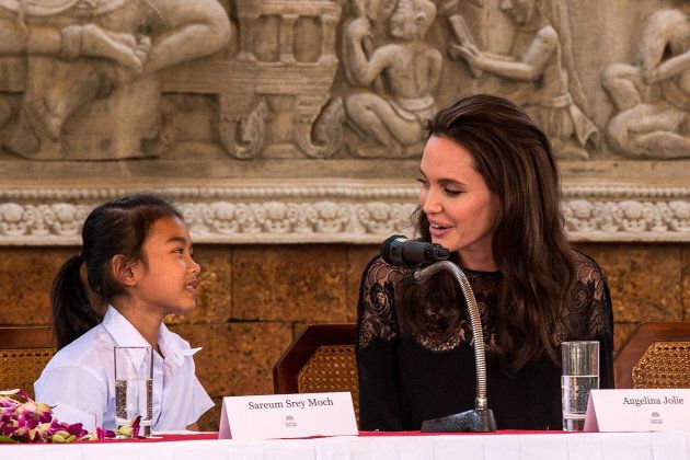 Angelina Jolie talks to actress Sareum Srey Moch during a press conference ahead of the premiere of their new movie 'First They Killed My Father' set up at the Raffles Grand Hotel D'Angkor on February 18, 2017 in Siem Reap, Cambodia. Angelina Jolie is in Siem Reap for the world premiere of her new movie, 'First They Killed my Father.' Omar Havana/Getty Images)