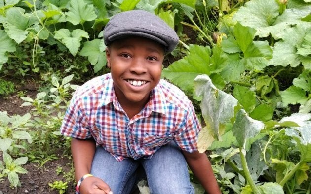 Spencer in his family's garden, where he has spent much of his time this summer.