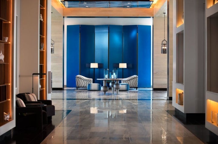 The cool blue tones of the lobby provide an impressive welcome.