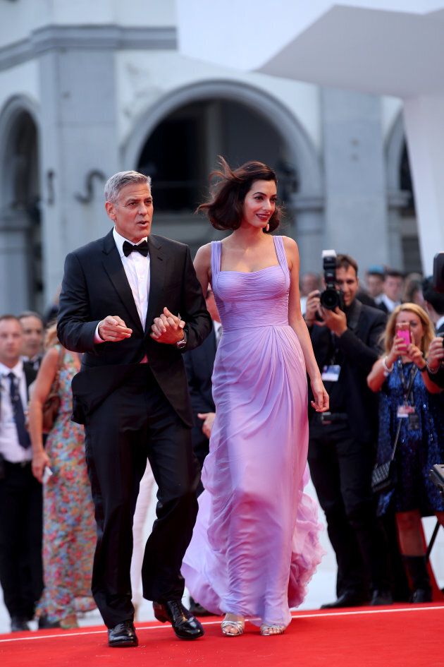 VENICE, ITALY - SEPTEMBER 02: George Clooney and Amal Clooney walk the red carpet ahead of the 'Suburbicon' screening during the 74th Venice Film Festival at Sala Grande on September 2, 2017 in Venice, Italy. (Photo by Franco Origlia/Getty Images)