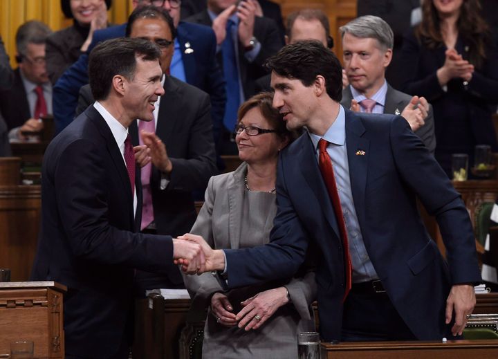 Prime Minister Justin Trudeau, right, shakes hands with Minister of Finance Bill Morneau following his federal budget speech in the House of Commons in Ottawa on March 22, 2016.