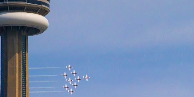 The CF Snowbirds fly past the CN Tower during the on 68th annual Canadian International Air Show during Canada's 150th anniversary year on Sept. 1, 2017 in Toronto, Ont.