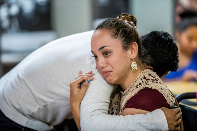 Paulina, 26, a DACA recipient, is comforted after watching U.S. Attorney General Jeff Sessions' announcement on the Deferred Action for Childhood Arrivals (DACA) program on a projection screen at the Coalition for Humane Immigrant Rights of Los Angeles headquarters in Los Angeles, Calif., Sept. 5, 2017.