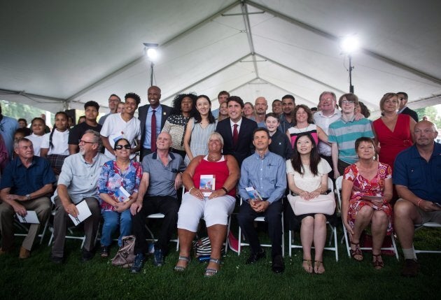 Prime Minister Justin Trudeau poses for a photograph with new Canadians after addressing a citizenship ceremony in Kelowna on Sept. 6, 2017.