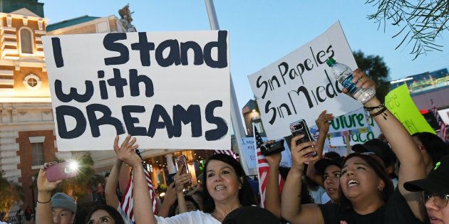 Immigrants and supporters chant outside the New York-New York Hotel & Casino on the Las Vegas Strip during a 'We Rise for the Dream' rally to oppose U.S. President Donald Trump's order to end DACA on Sept.10, 2017 in Las Vegas, Nev.