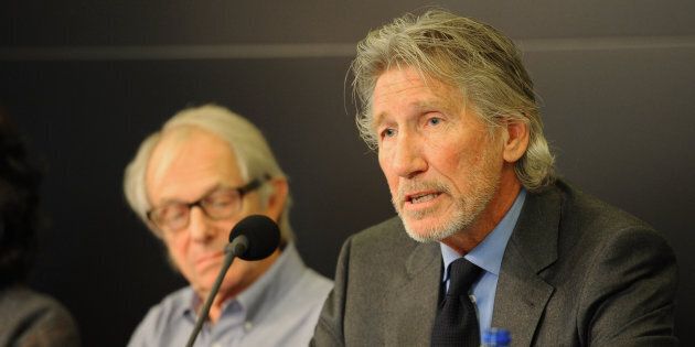 English film and television director Ken Loach (L), English musician and co-founder of rock band Pink Floyd Roger Waters (R) attend the Russell Tribunal at the International Press Office in Brussels, Belgium, on Sept. 25, 2014.