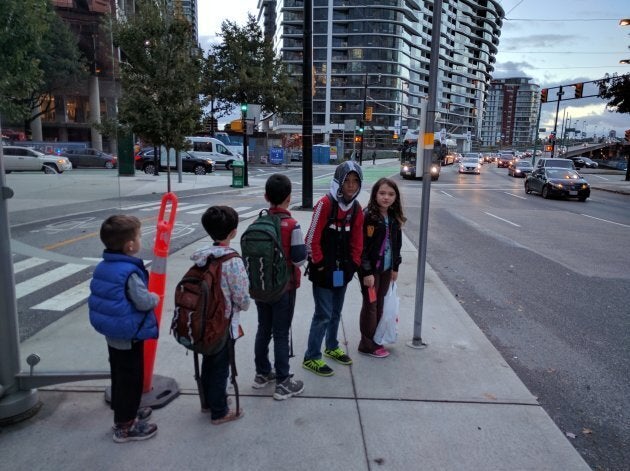 The kids queued up to get on the bus in the morning.