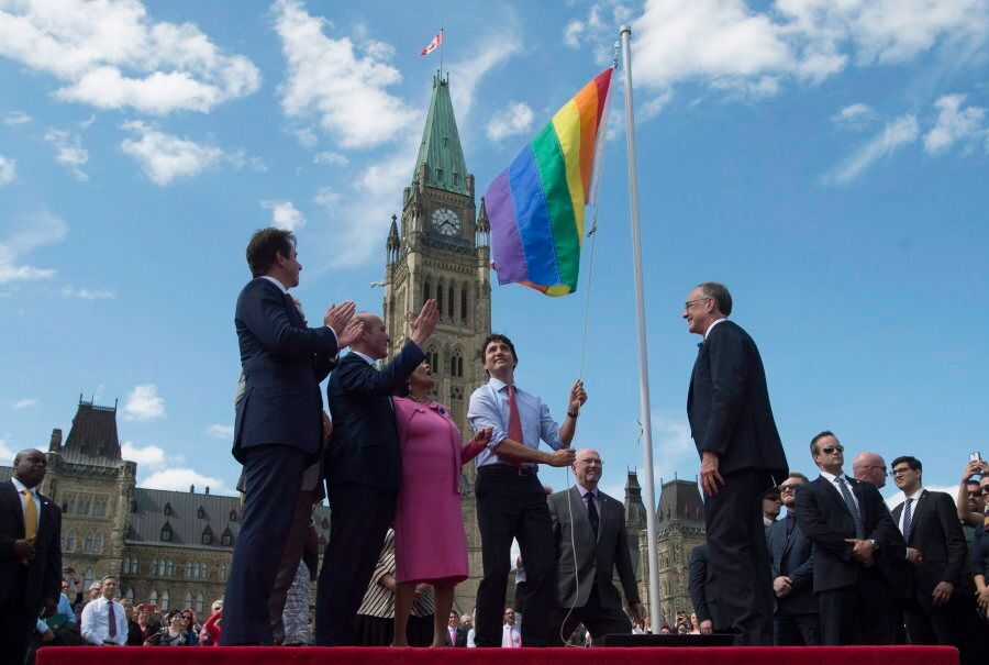 Prime Minister Justin Trudeau takes part in a Pride flag raising ceremony on Parliament Hill on June 1, 2016.