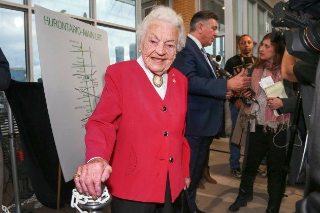 Retired Mississauga mayor Hazel McCallion at a news conference, with Finance Minister Charles Sousa being interviewed, at City Centre Transit Terminal in Mississauga, Ont., April 21, 2015.