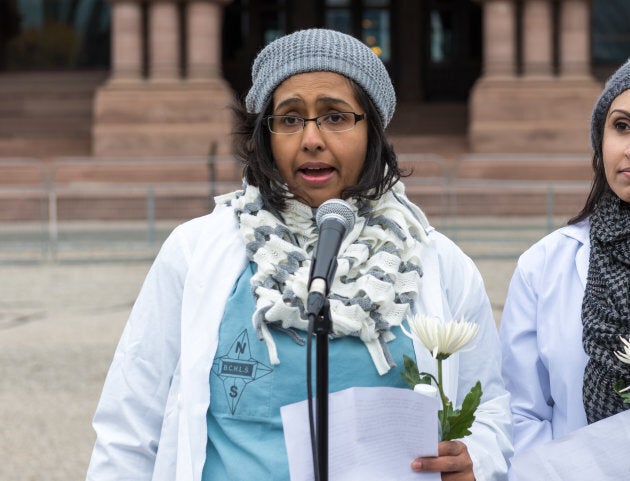 Dr. Nadia Alam addresses people and media against the cuts to health care from the Liberal government.