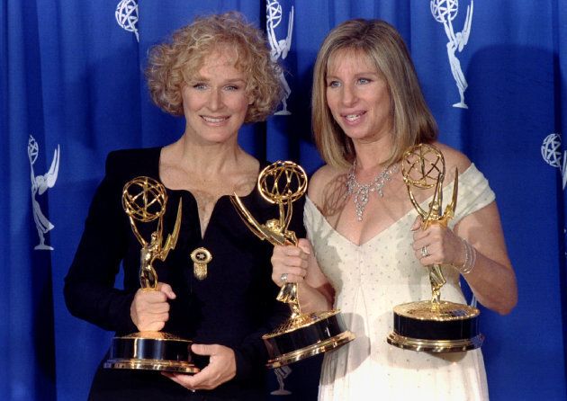 Glenn Close holds the Emmy she received for Best Lead Actress in a Miniseries or Special for her role in "Serving in Silence: The Margarethe Cammermeyer Story" as she poses with Barbra Streisand, who produced the special, at the 47th Annual Emmy Awards in Pasadena.