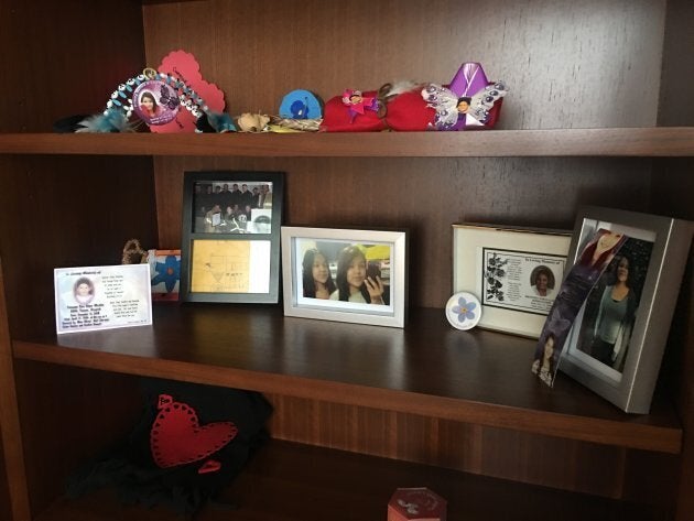 Photos of young people who died in Northern Ontario sit on a bookshelf in Charlie Angus' office.