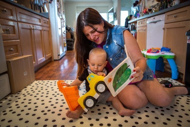 Alana Kayfetz, founder of MomsTO plays with her 1-year-old son Elias Kantor at her Toronto home on Friday.