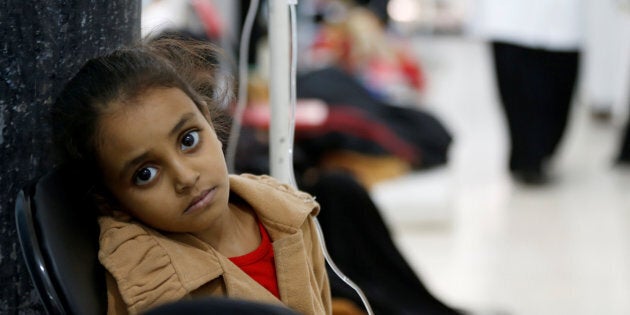 A girl infected with cholera sits on a chair at a hospital in Sanaa, Yemen May 7, 2017.