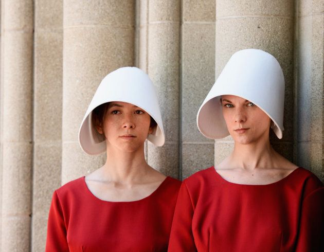 Performers pose as Handmaids to promote the new series 'The Handmaid's Tale' at the Los Angeles Times Festival Of Books at USC on April 23, 2017 in Los Angeles, California. (Tara Ziemba/Getty Images,)