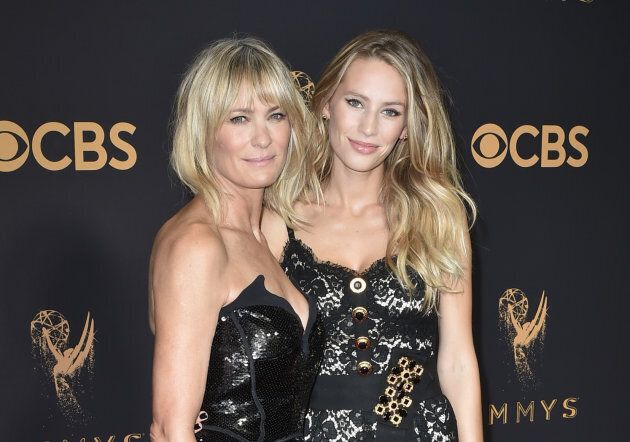 Robin Wright (L) and Dylan Penn pose for a photo at the 2017 Emmys.