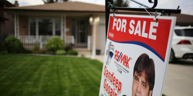 A house for sale through a realtor in Hamilton, Ont., May 13, 2017. The head of the Ontario Real Estate Association says the recent changes to housing rules across Canada amount to a