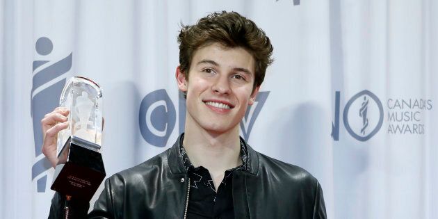 Shawn Mendes holds his award for Artist of the Year backstage at the 2017 Juno Awards in Ottawa on April 2, 2017.