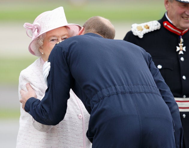 Prince William, Duke of Cambridge kisses his grandmother Queen Elizabeth II goodbye after she opened the new East Anglian Air Ambulance base at Cambridge Airport on July 13, 2016 in Cambridge, England. (Photo by Max Mumby/Indigo/Getty Images)