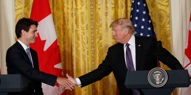 Prime Minister Justin Trudeau shakes hands with U.S. President Donald Trump during a joint news conference at the White House in Feb. 13, 2017. A new poll finds the vast majority of Canadians are willing to walk away from NAFTA talks if they result in a