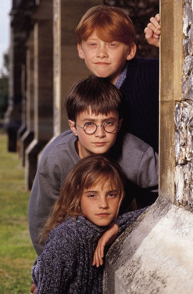 Rupert Grint as Ron Weasley, Daniel Radcliffe as Harry Potter and Emma Watson as Hermione Granger.