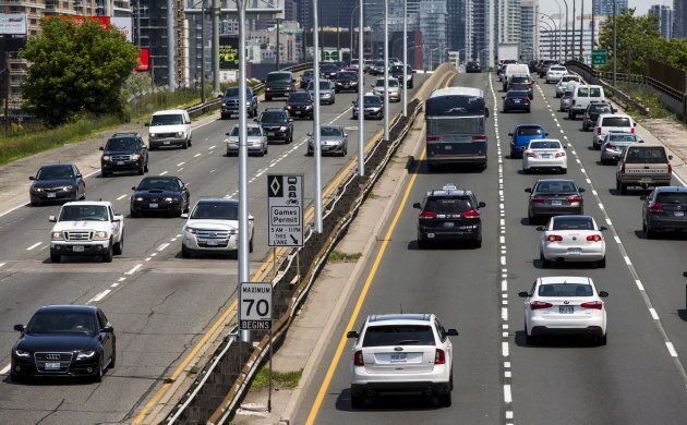 Cars drive in heavy traffic on the Gardiner Expressway in Toronto, June 29, 2015.