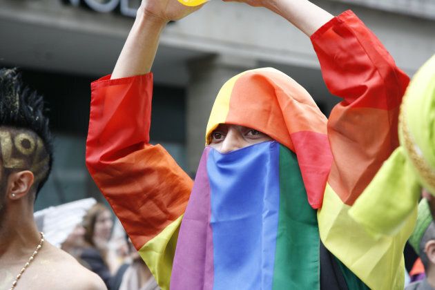 A Muslim wearing rainbow cloth takes part in London's Gay Pride, July 7, 2012.