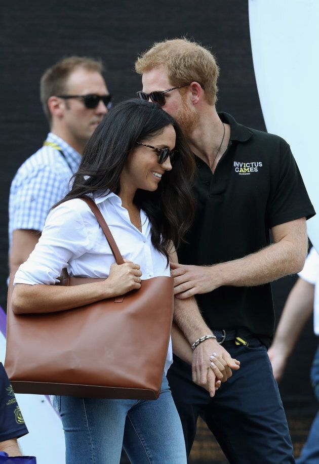 Prince Harry and Meghan Markle hold hands at a wheelchair tennis match during the Invictus Games 2017 on September 25, 2017 in Toronto. (Chris Jackson/Getty Images for the Invictus Games Foundation )