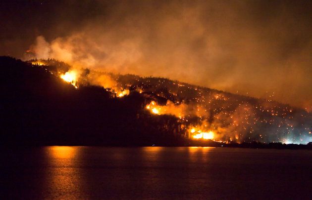 A forest fire burns on the edge of Kelowna, British Columbia, July 19, 2009.