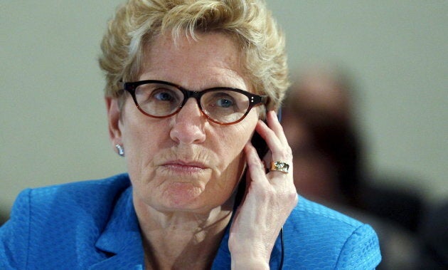 Ontario Premier Kathleen Wynne at the Quebec Summit On Climate Change in Quebec City, April 14, 2015. A new TD Bank report says the province's move to a $15-an-hour minimum wage is happening too quickly.