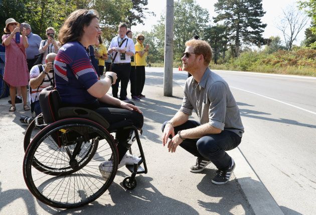 Prince Harry meets up with an athlete as he attends the Cycling Criterium time trial during the Invictus Games 2017 on September 27, 2017 in Toronto. (Chris Jackson/Getty Images for the Games Foundation)