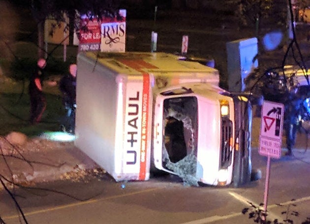 A rental truck lies on its side in Edmonton on Sunday.