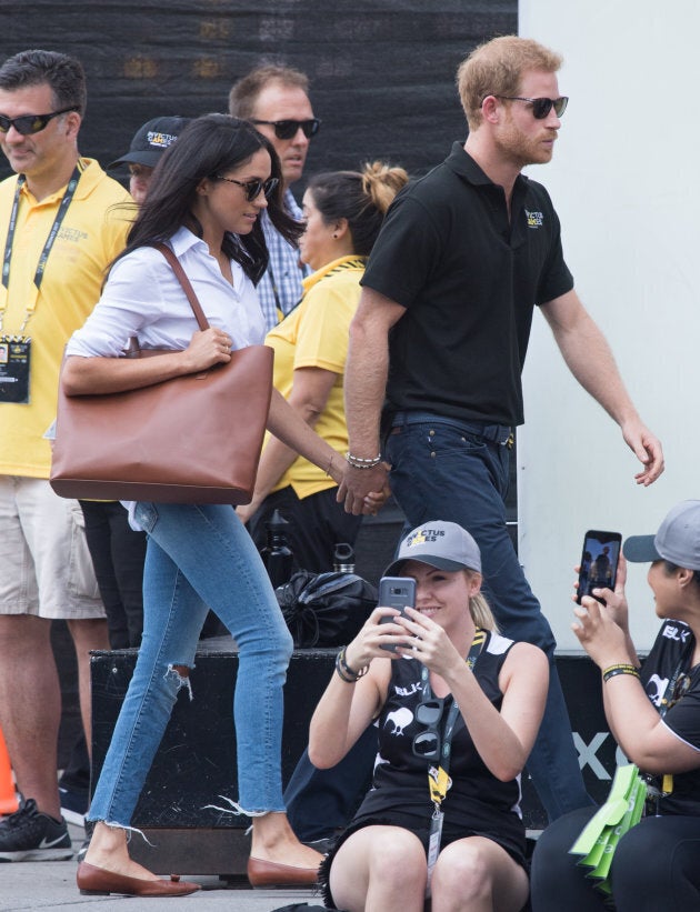 Meghan Markle and Prince Harry at the wheelchair tennis on day three of the Invictus Games on Monday. Holding hands!