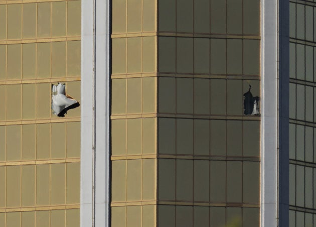 Two broken windows are seen at the Mandalay Bay Resort and Casino following a mass shooting at the Route 91 Festival in Las Vegas, Nev. on Monday.