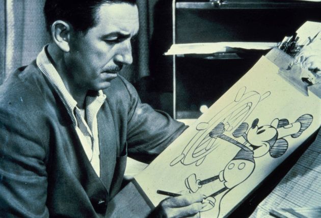 Walt Disney is pictured at the drawing board with a sketch of his famous character, Mickey Mouse.