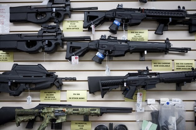 Semi-automatic weapons for sale are on display at a Texas gun dealer.