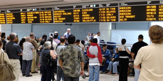 People waiting at an arrival hall at Toronto's Lester B. Pearson Airport. New data from Statistics Canada shows Canada's reliance on immigration for population growth is at an all-time high.