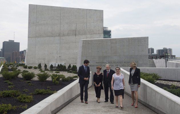 Prime Minister Justin Trudeau speaks with Holocaust survivors Georgette Brinberg, Philip Goldig, Eva Kuper and Heritage Minister Melanie Joly after visiting the National Holocaust Monument in Ottawa on Sept. 27, 2017.