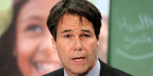 Health Minister Eric Hoskins speaks to media at Lord Dufferin Public School during a news conference to re-launch Ontario's Healthy Smiles dental program aimed at low-income kids, April 26, 2016.