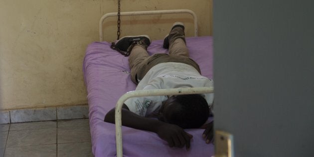 A chained mental patient is seen at the psychiatry department of Juba Education Hospital in Juba, South Sudan on October 11, 2016.