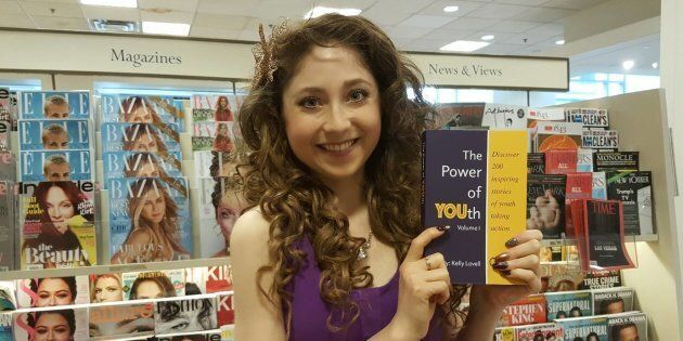 Kelly Lovell holding her latest book The Power of YOUth, which is filled with 200 stores of young entrepreneurs taking action to solve pressing social challenges. https://changegen.com/book