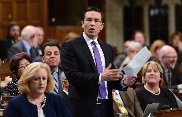 Conservative MP Pierre Poilievre stands during question period in the House of Commons on Parliament Hill in Ottawa on Thursday, Oct. 5. Poilievre is criticizing a Canada Revenue decision to tax employee discounts.