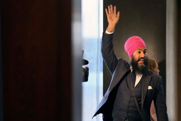 Jagmeet Singh waves to supporters as he walks into a hotel ballroom for the New Democratic Party leadership vote, Oct. 1, 2017.