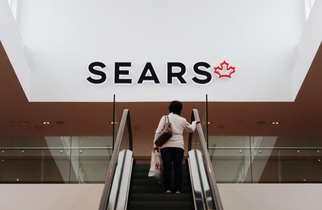 A woman takes an escalator to a Sears store in Mississauga, Ont., Oct. 6, 2017.