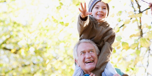A grandfather carries his grandson on his shoulders. A new study finds that people who lived close to trees or vegetation had an eight to 12 per cent reduced risk of dying compared to those that didn't.